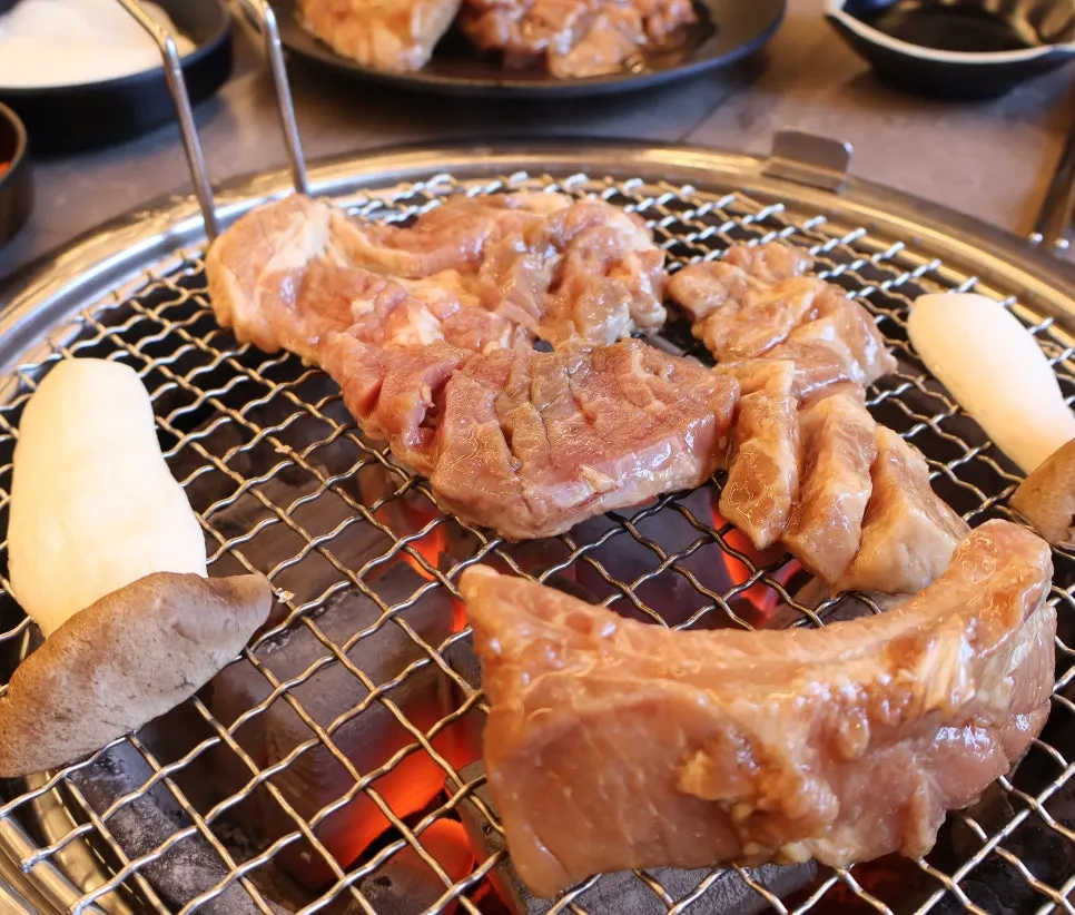 Thick-cut seasoned pork galbi before grilling