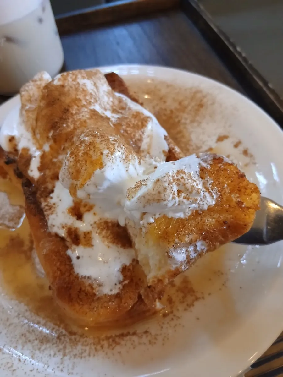 Warm bread scooped together with cold cream