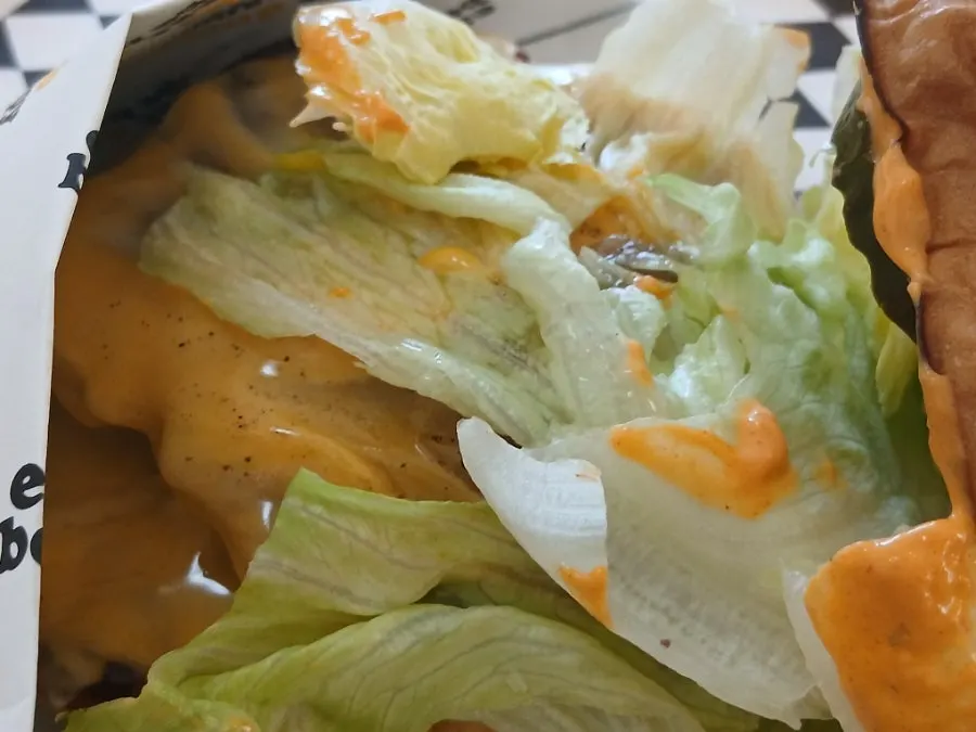 Patty with cheese melted throughout the double Deom Burger