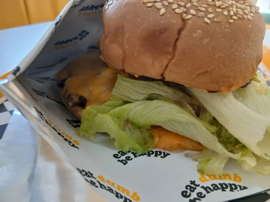 Close-up of the burger topped with colby jack cheese