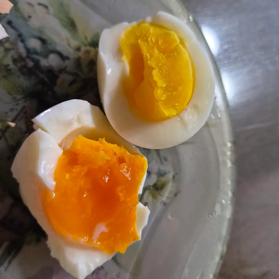 Plate with both fried and soft-boiled eggs