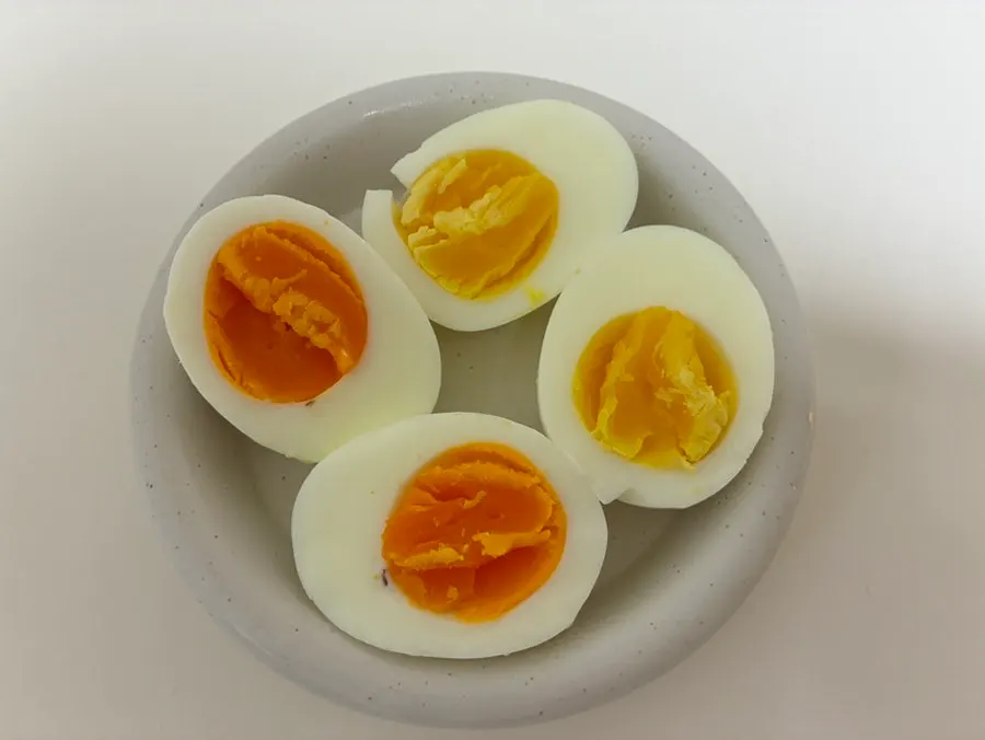 Boiled eggs comparing the yellow yolk and orange yolk