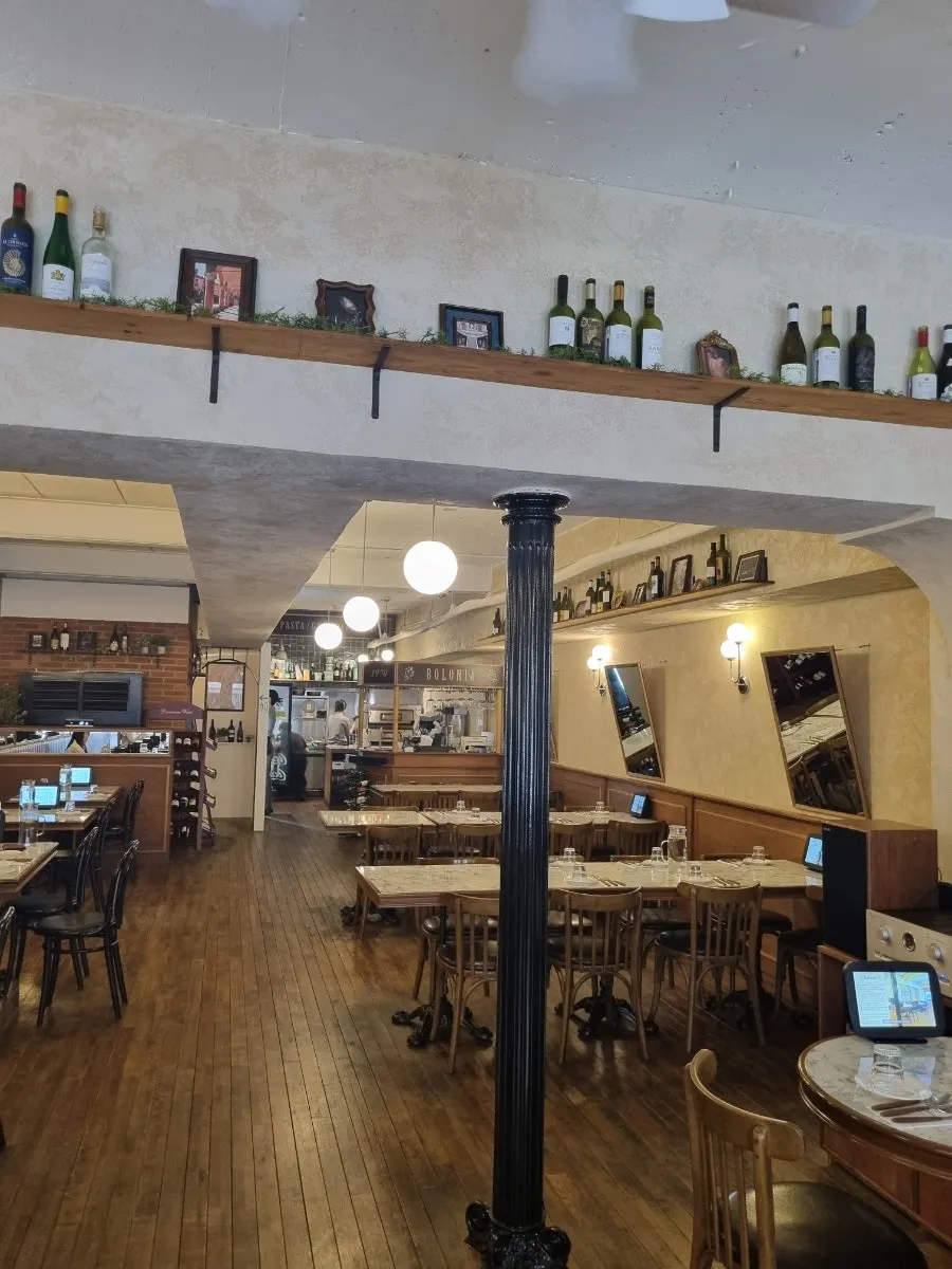 Restaurant interior with wine and framed pictures