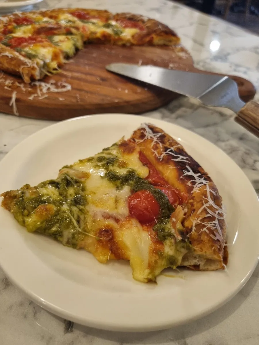 Margherita pizza topped with basil