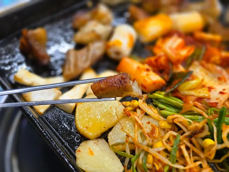 Staff cooking the mixed gopchang platter