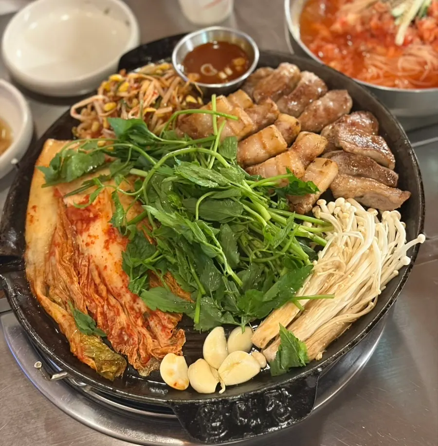 Platter of grilled pork belly and pork neck jowl