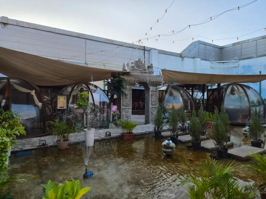 Outdoor rooftop space with a Southeast Asian feel