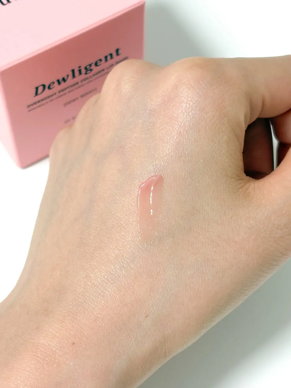 Moisturizing layer from lip mask applied to the back of a hand