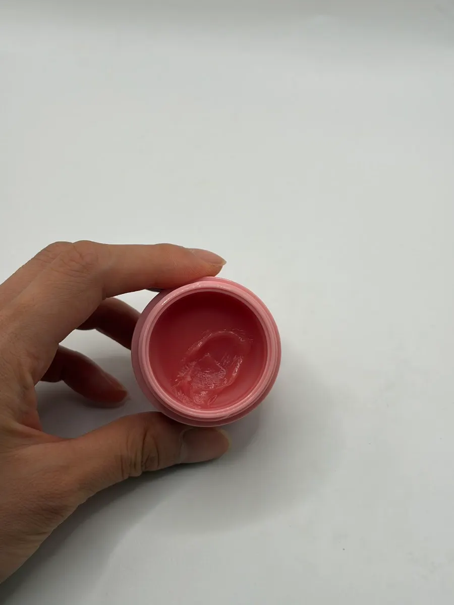 Durgent Lip Mask with a cherry-colored balm texture