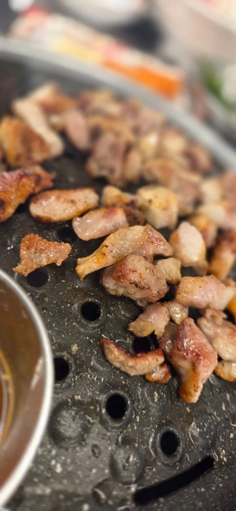 Pork grilling over charcoal