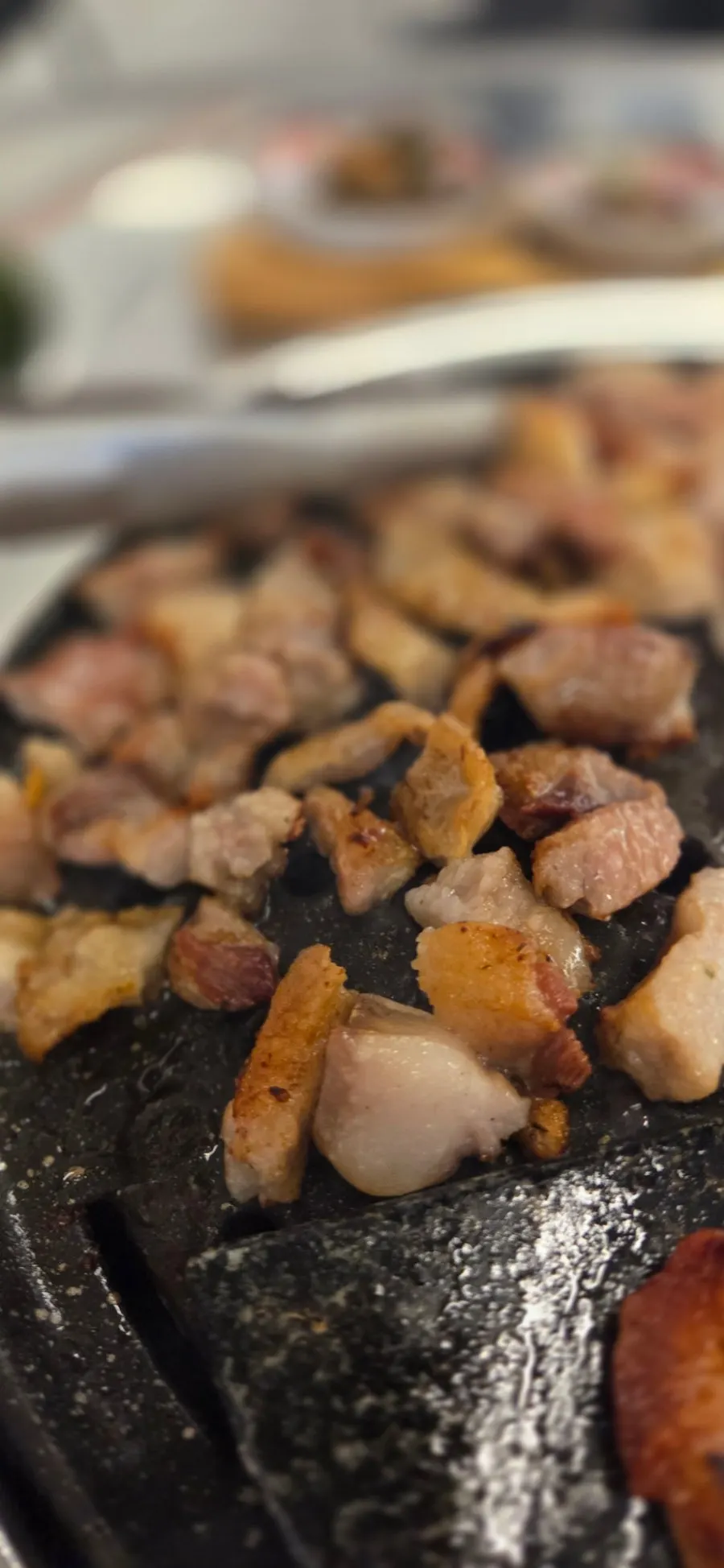 Several cuts of meat together on the grill plate