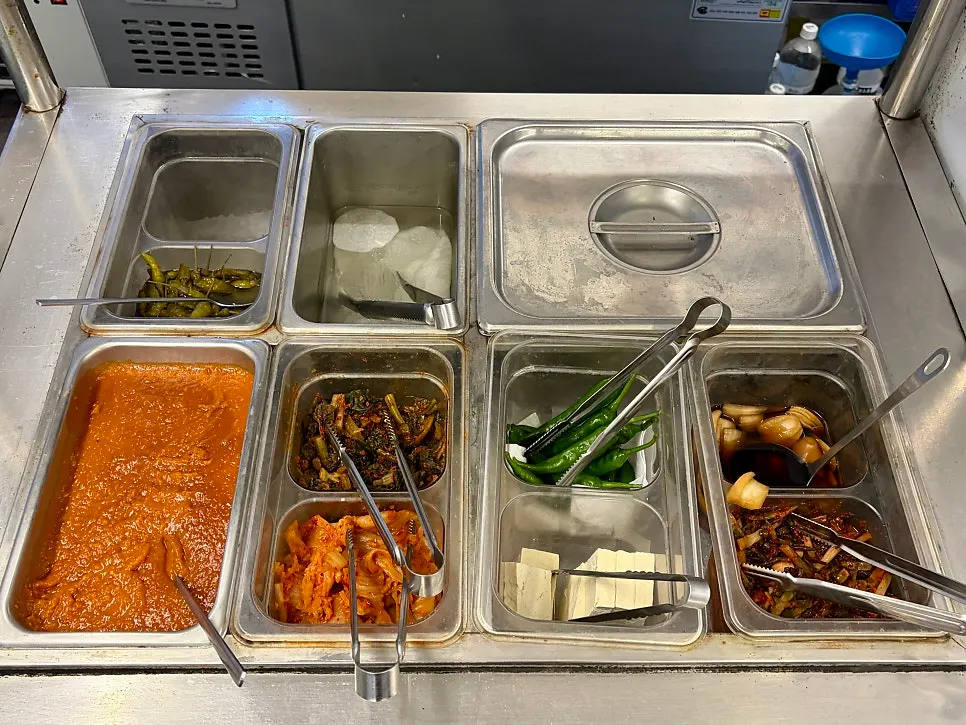 Self-serve bar stocked with side dishes