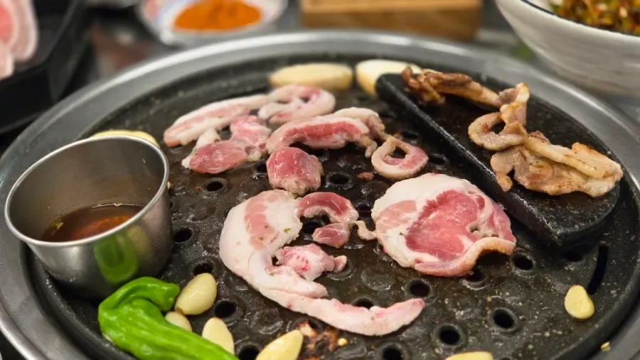 Thick-cut premium hanwoo-fed pork belly grilling