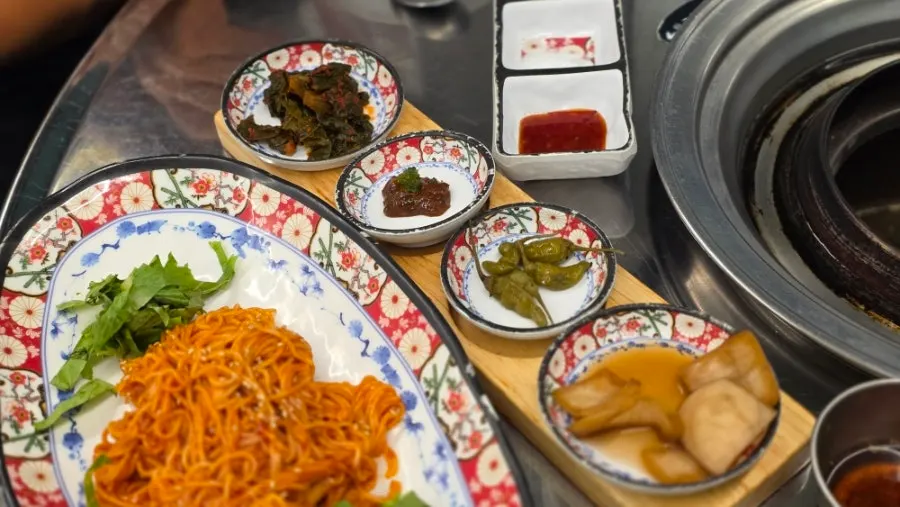 Containers of side dishes displayed at the self-serve bar