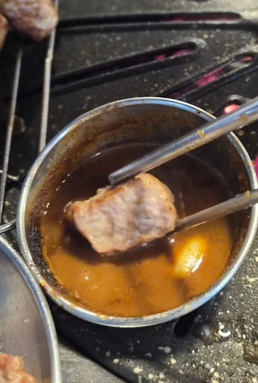 Pork neck piece topped with garlic sauce