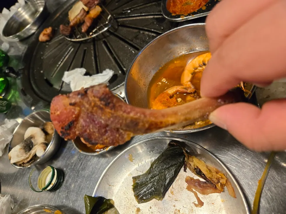 Four grilled black pork sausage links