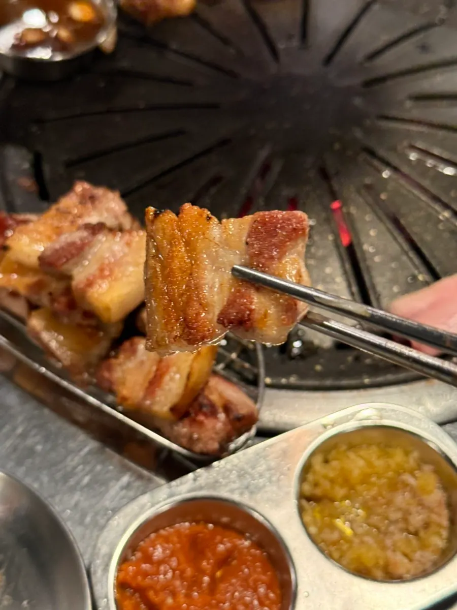 Dipping sauces alongside the grilled kimchi