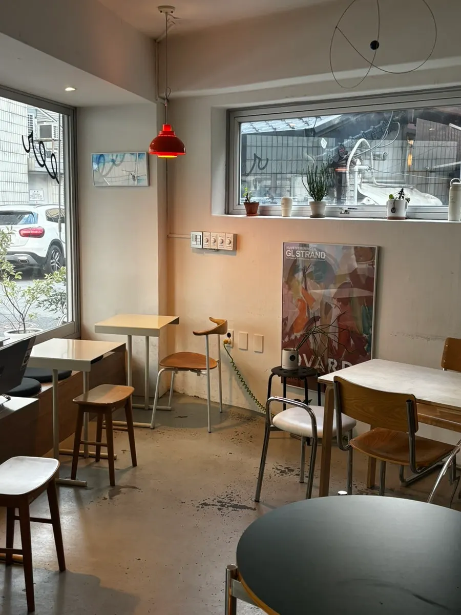 Café interior with paintings hung on the wall