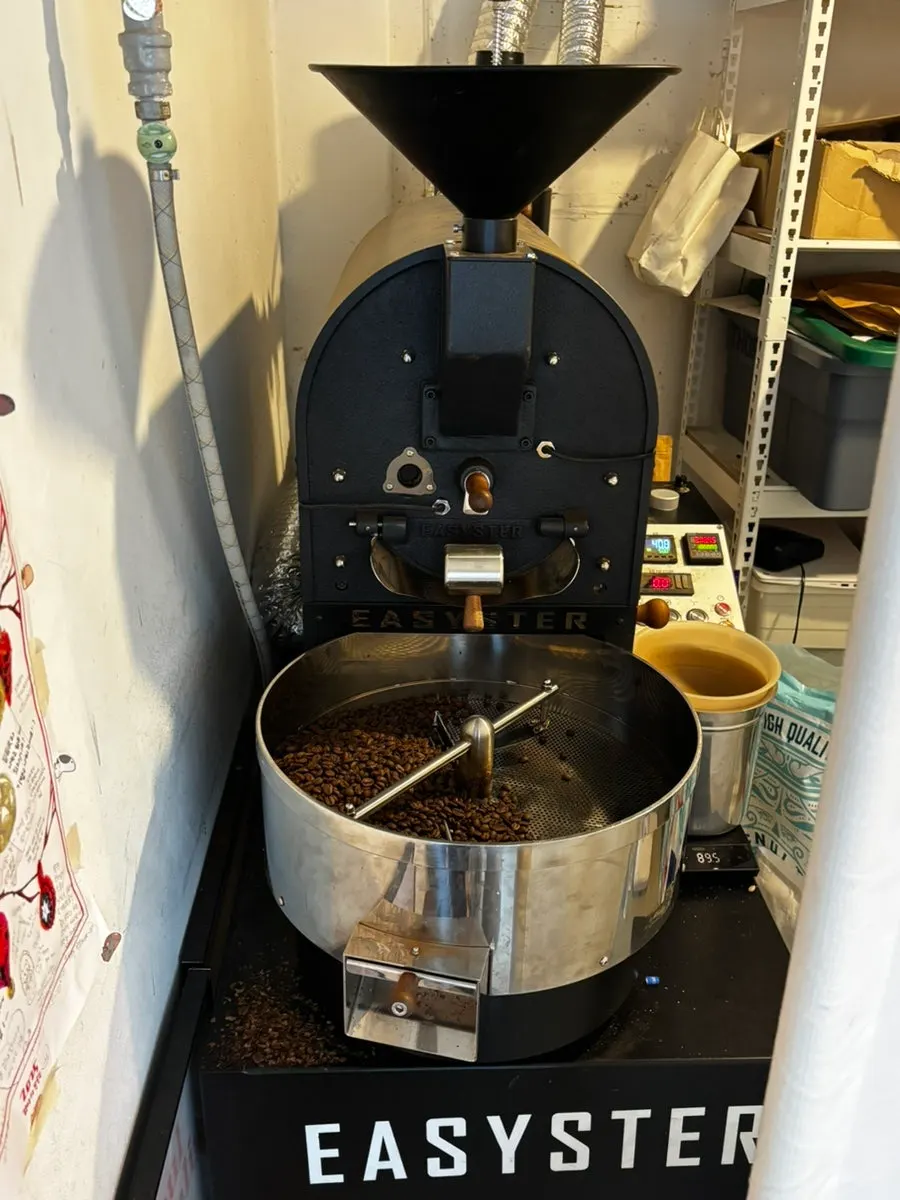 Bean roasting machine in a corner of the shop