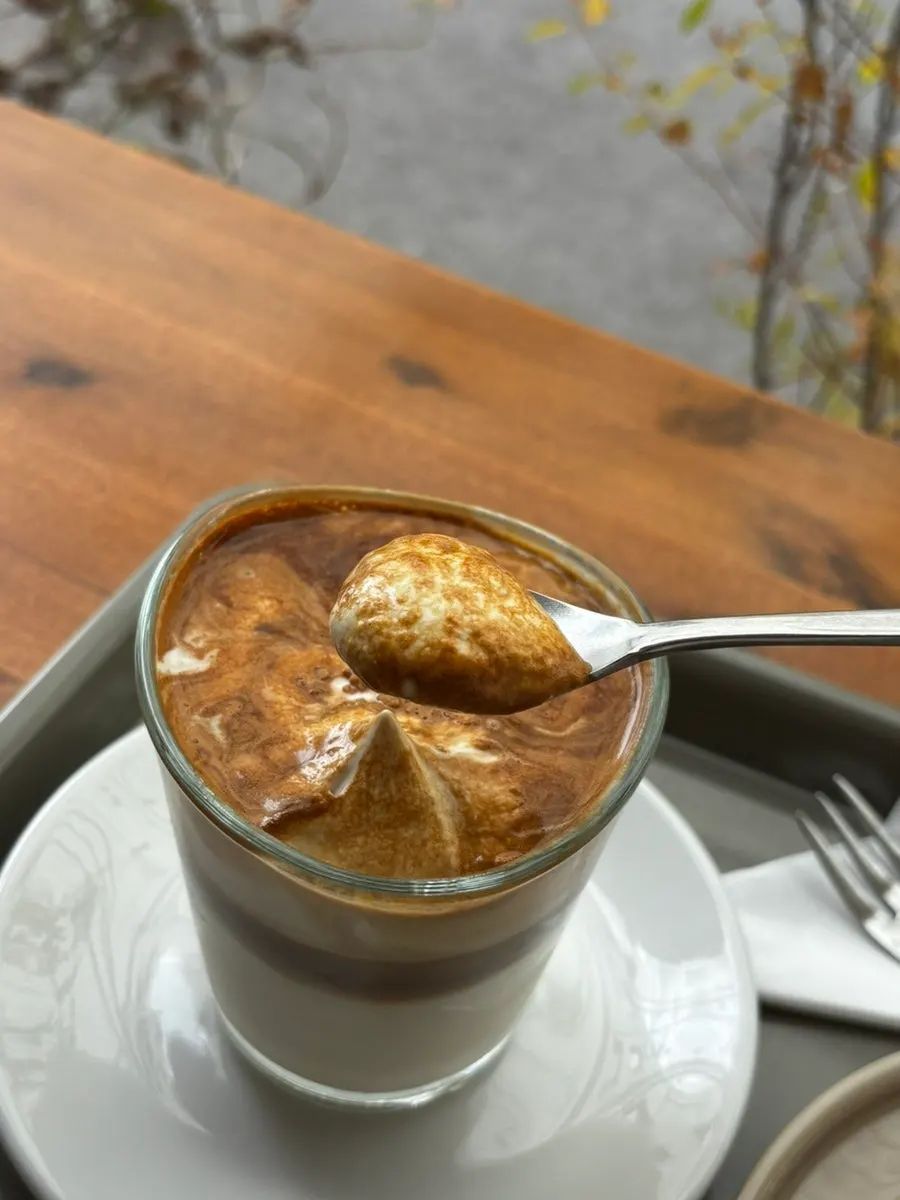 Close-up of the cream almond latte cup