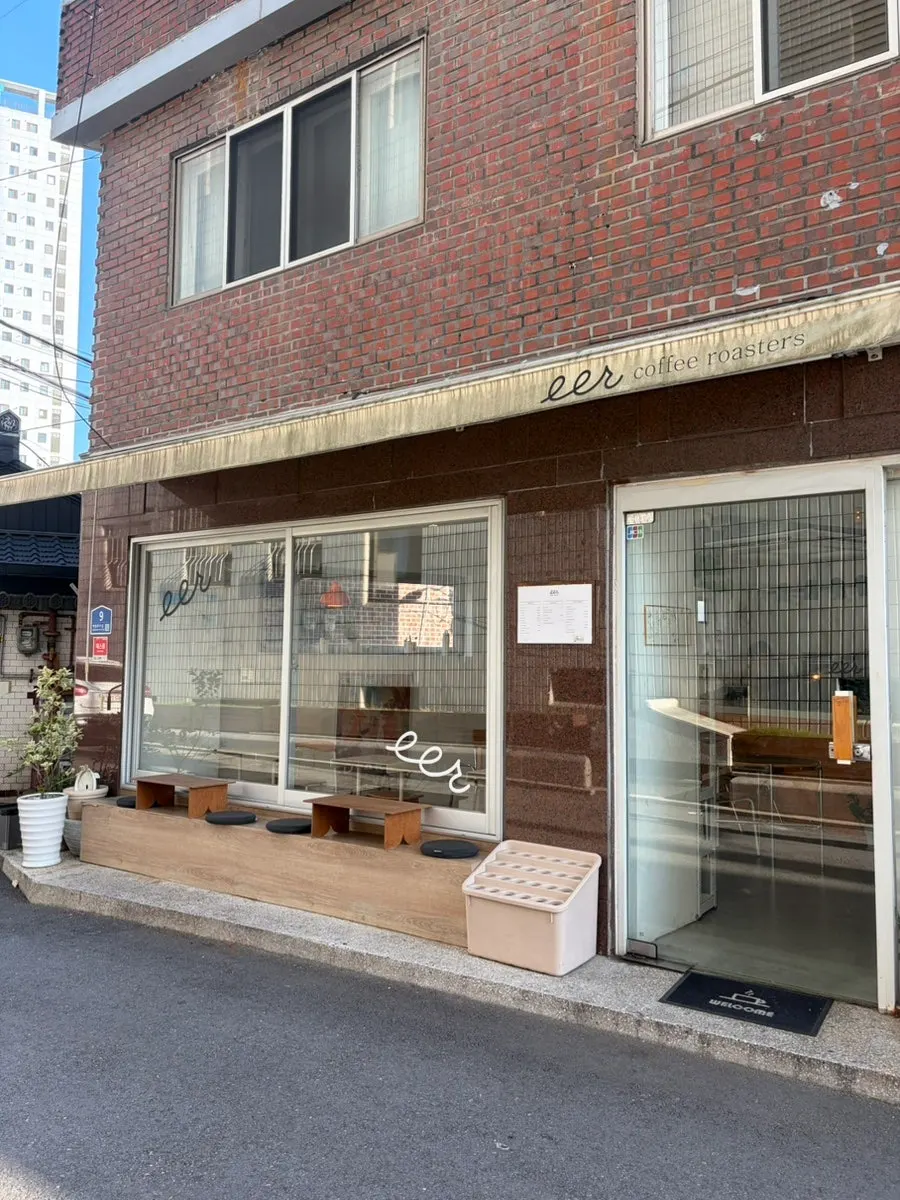 View around the café entrance with potted plants