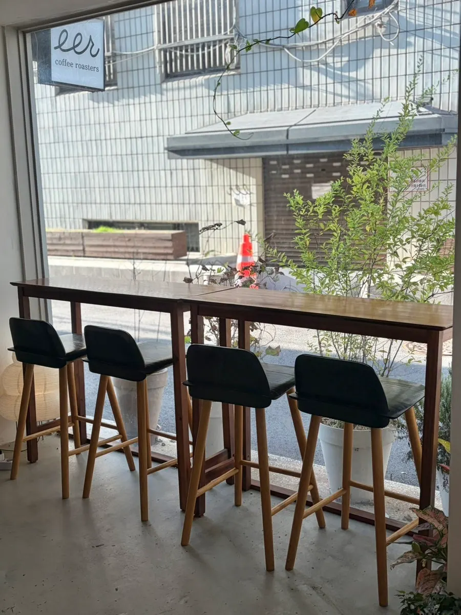 Outdoor seating at the red brick café building