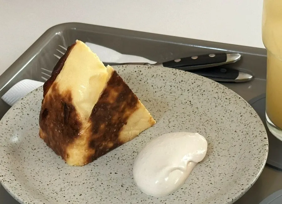 Basque cheesecake served alongside the drinks
