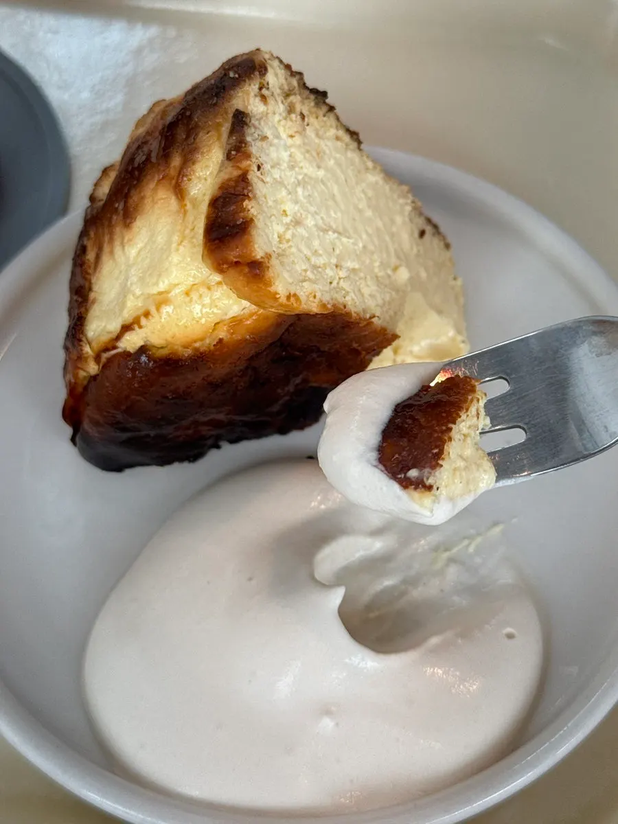 Basque cheesecake served with cream sauce