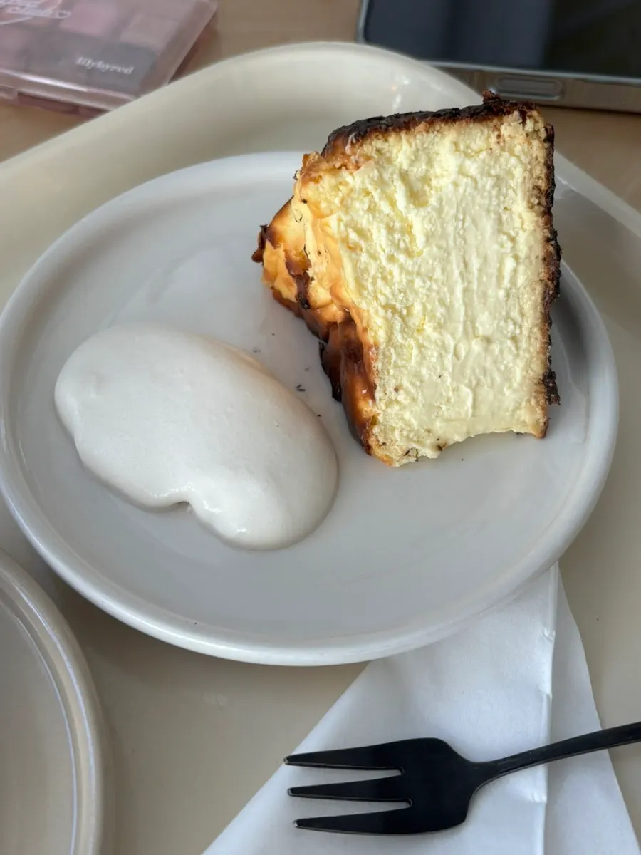 Moist cheesecake filling scooped out with a fork