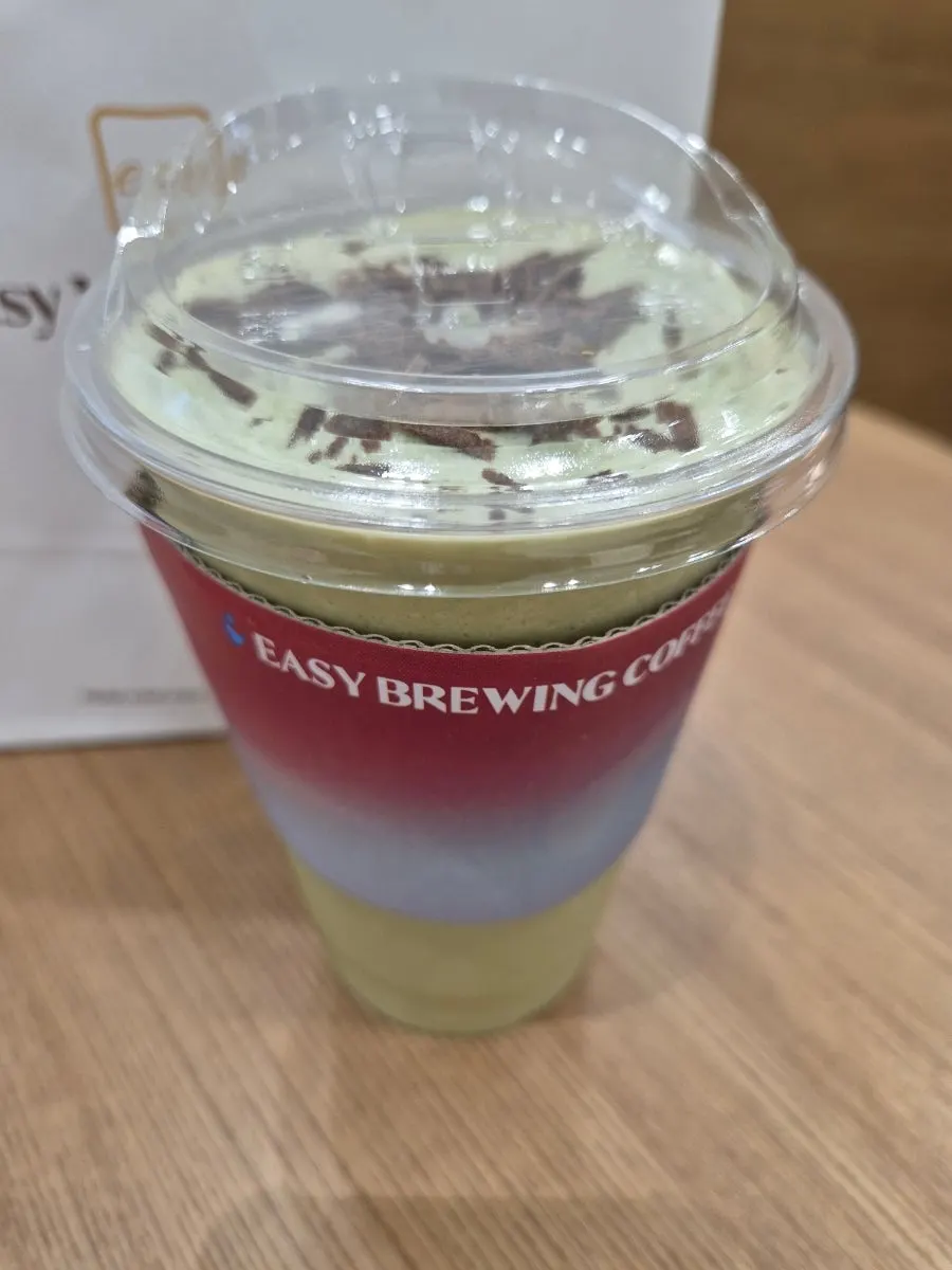 Matcha drink served alongside cranberry milk bread