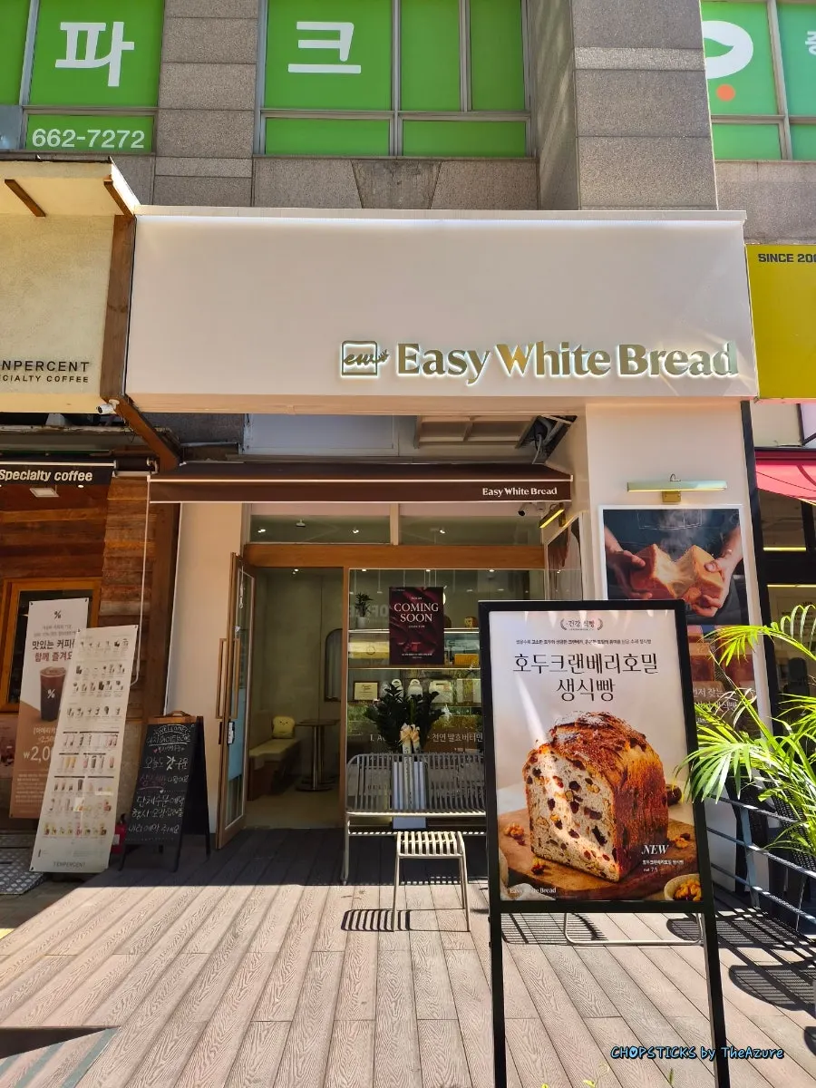 Sign showing the 5 milk bread varieties, handmade jam, and brewed coffee menu
