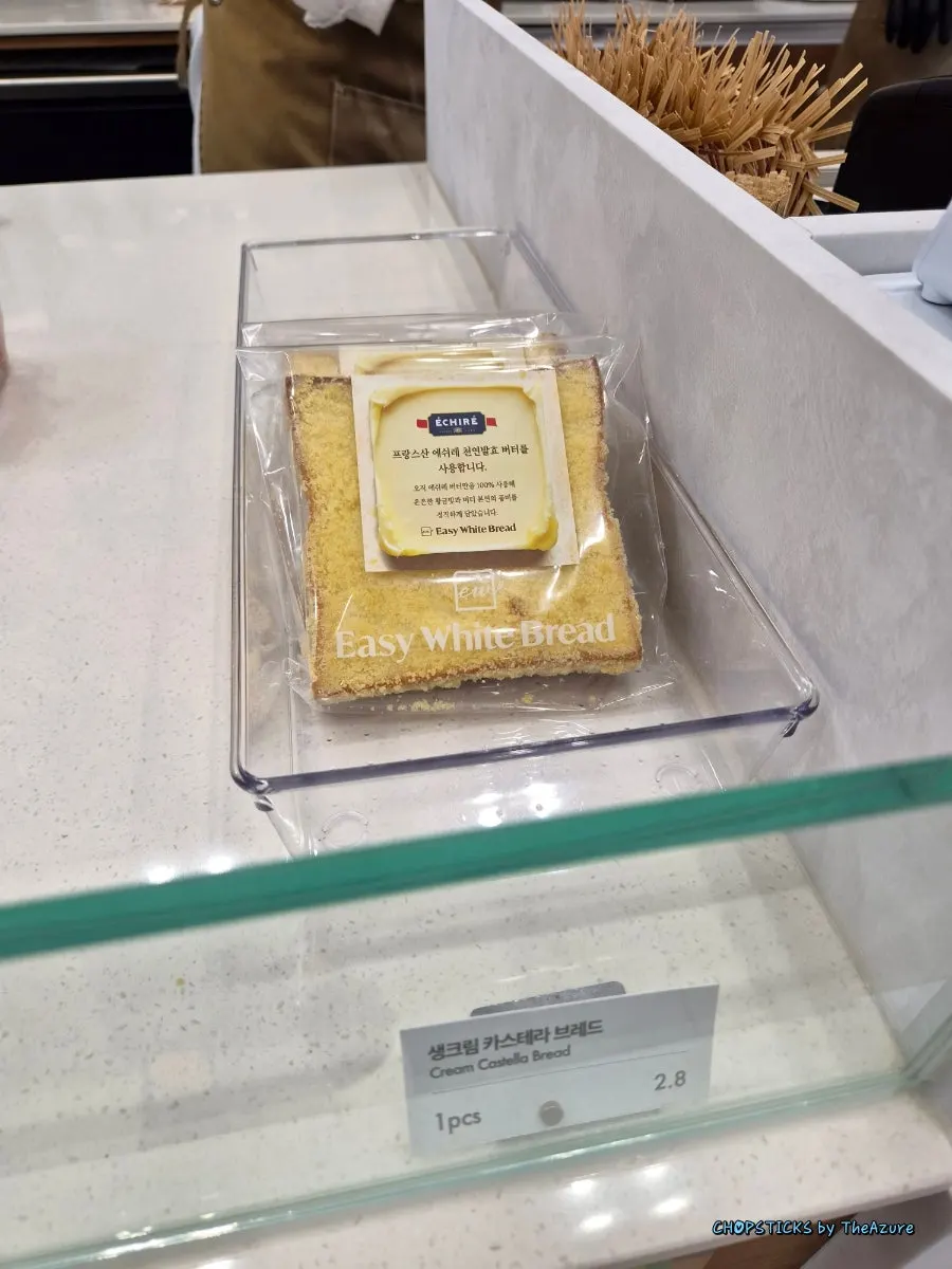 Golden-brown, square milk breads on display