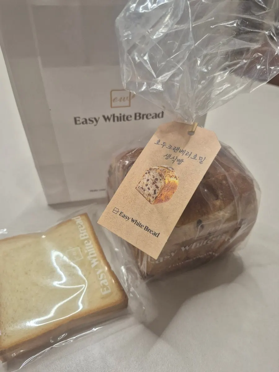 A whole loaf of walnut cranberry rye milk bread