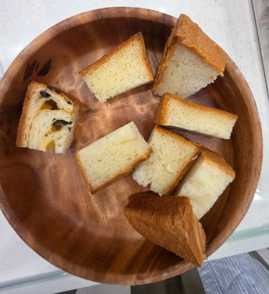 Tasting corner with milk bread in a wooden bowl
