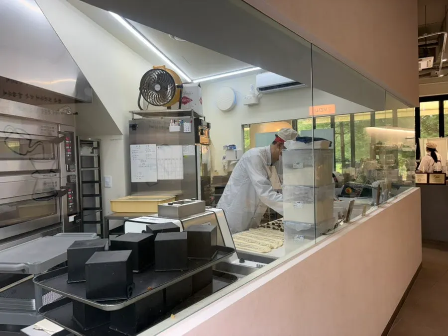 The floor-to-ceiling glass baking workspace