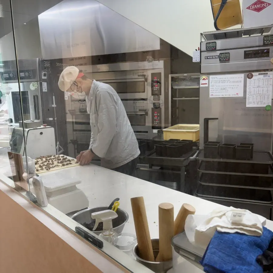 Café seating with a view into the baking space