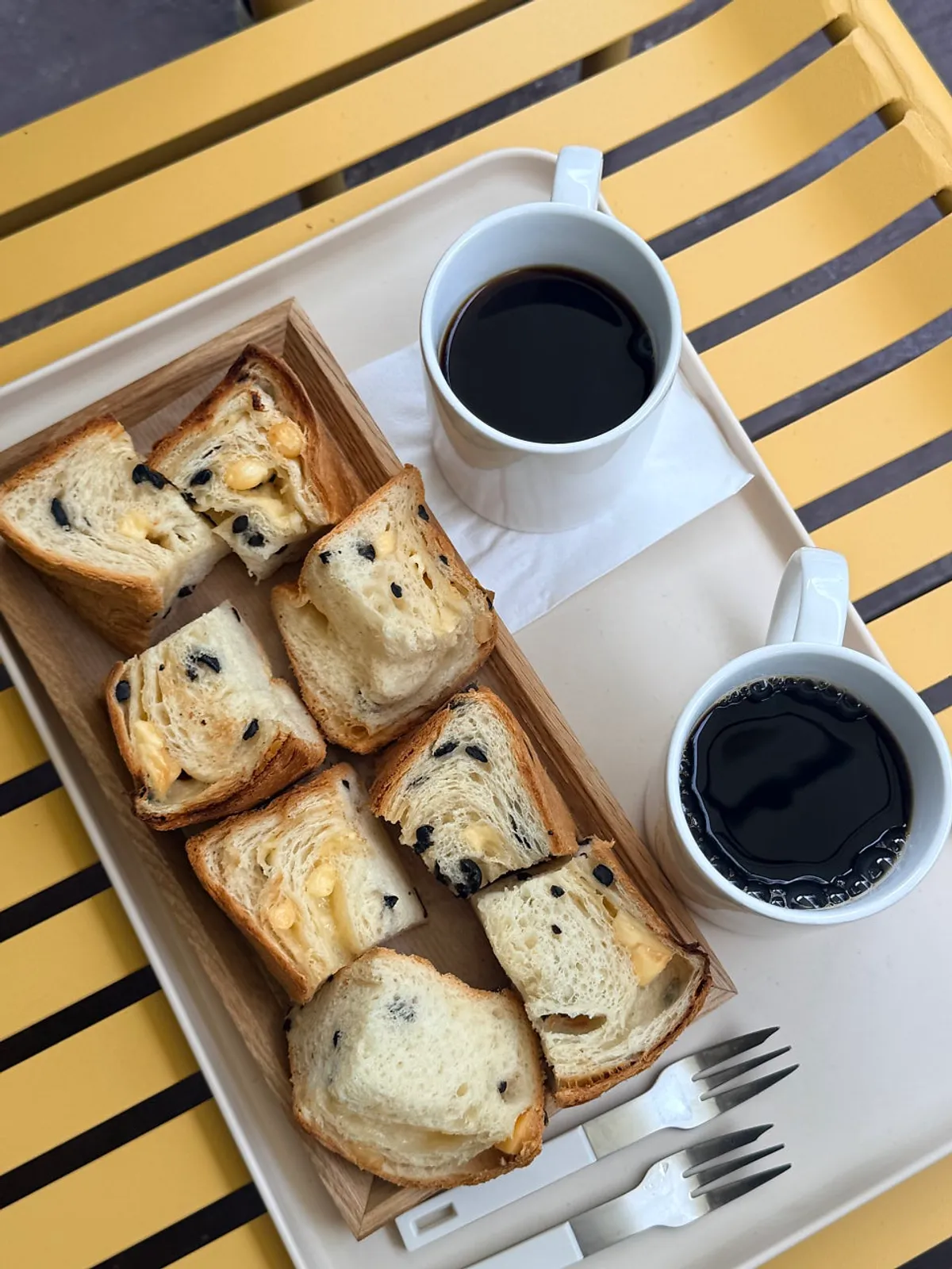 Plate of sliced olive cheese milk bread