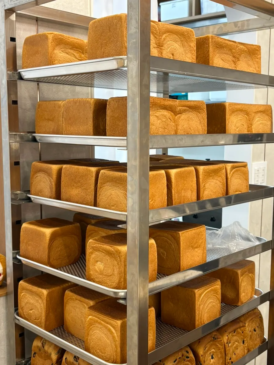 Packed takeout bag of Easy White Bread bread