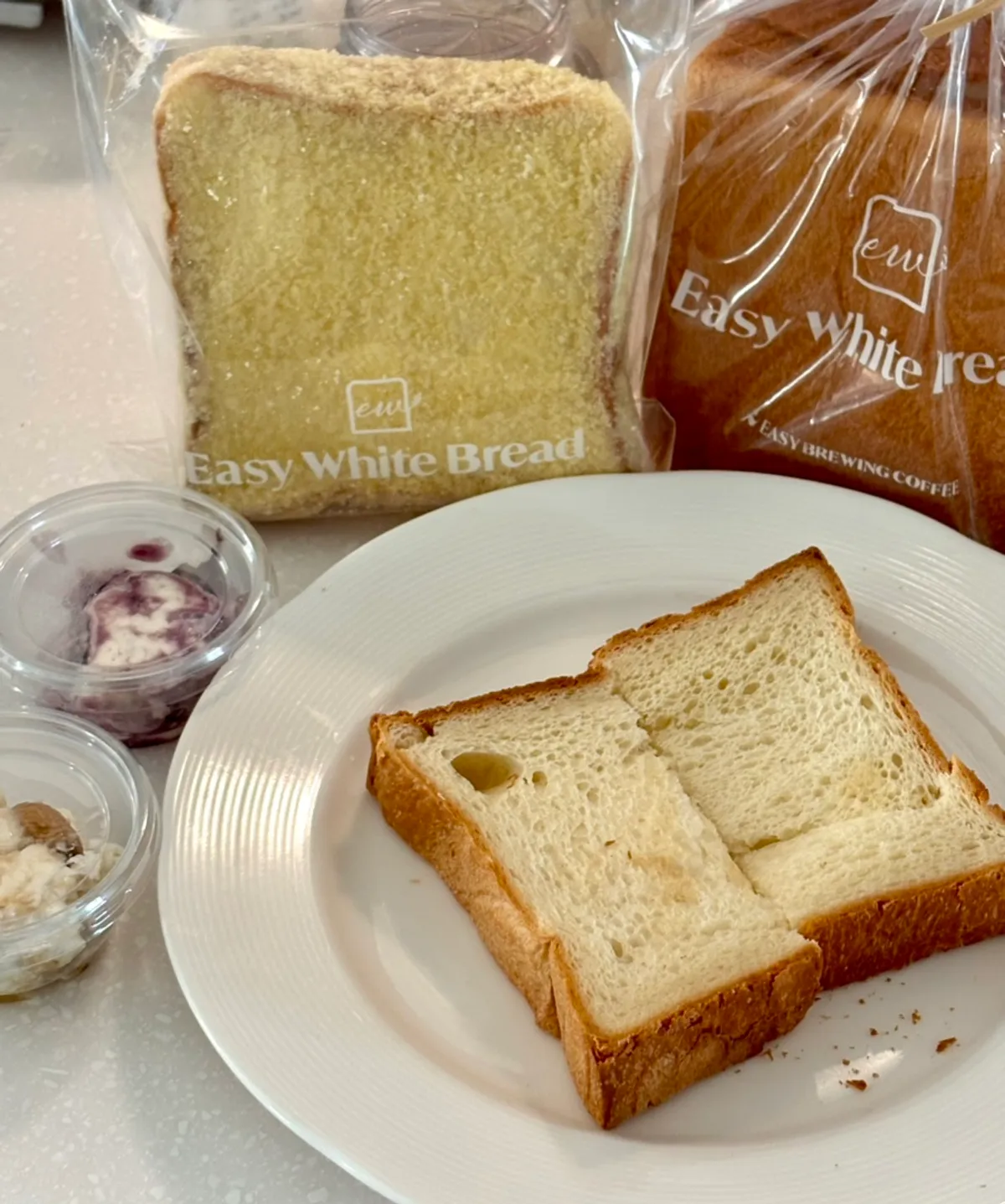 A piece of milk bread topped with blueberry cream cheese
