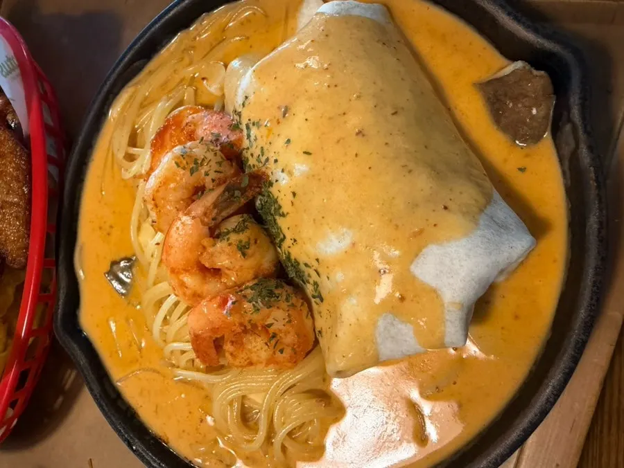 Chipotle cream pasta and chicken burrito
