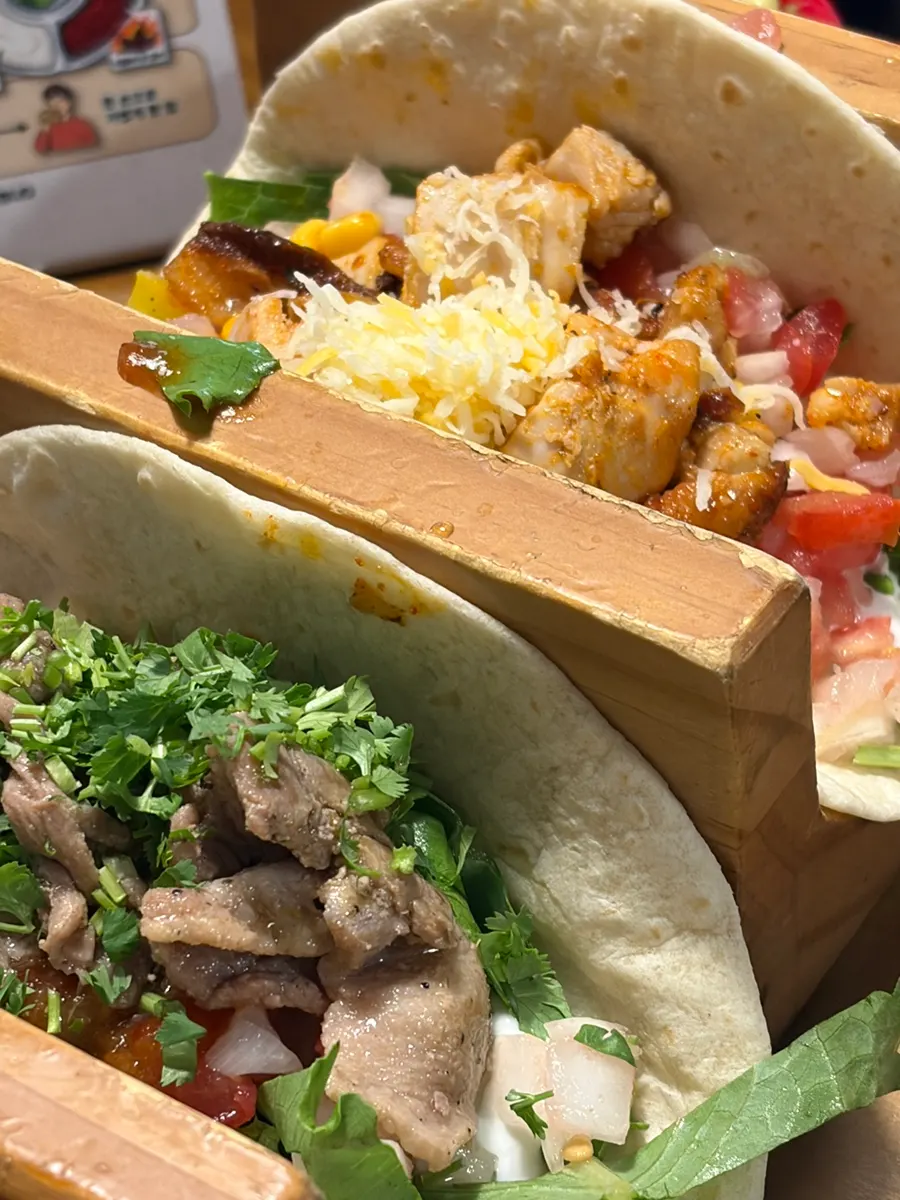 A plate of tacos loaded with fillings