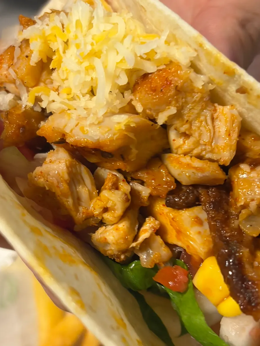 Close-up of a taco topped with sauce