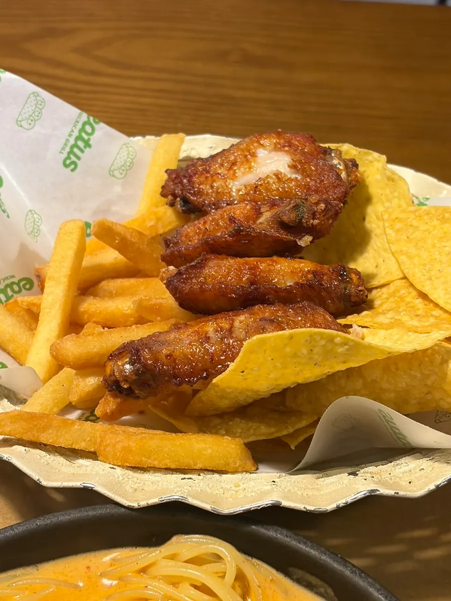 Nacho chips with a plate of sauces