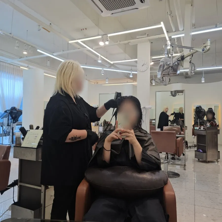 Mid-length hair undergoing volume magic straightening