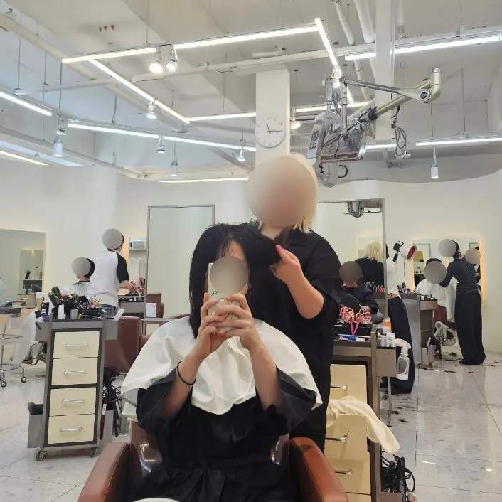 Checking hair condition midway through the treatment