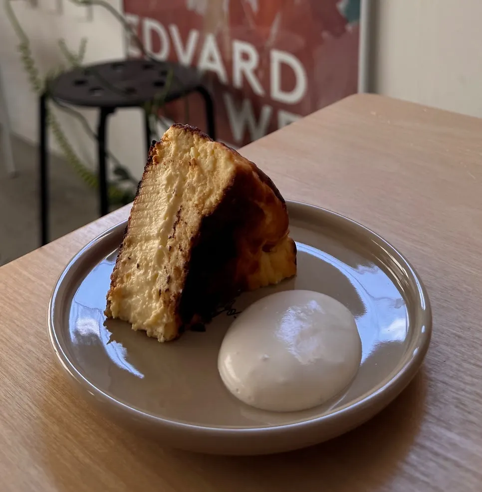 Cross-section of Basque cheesecake lifted by fork