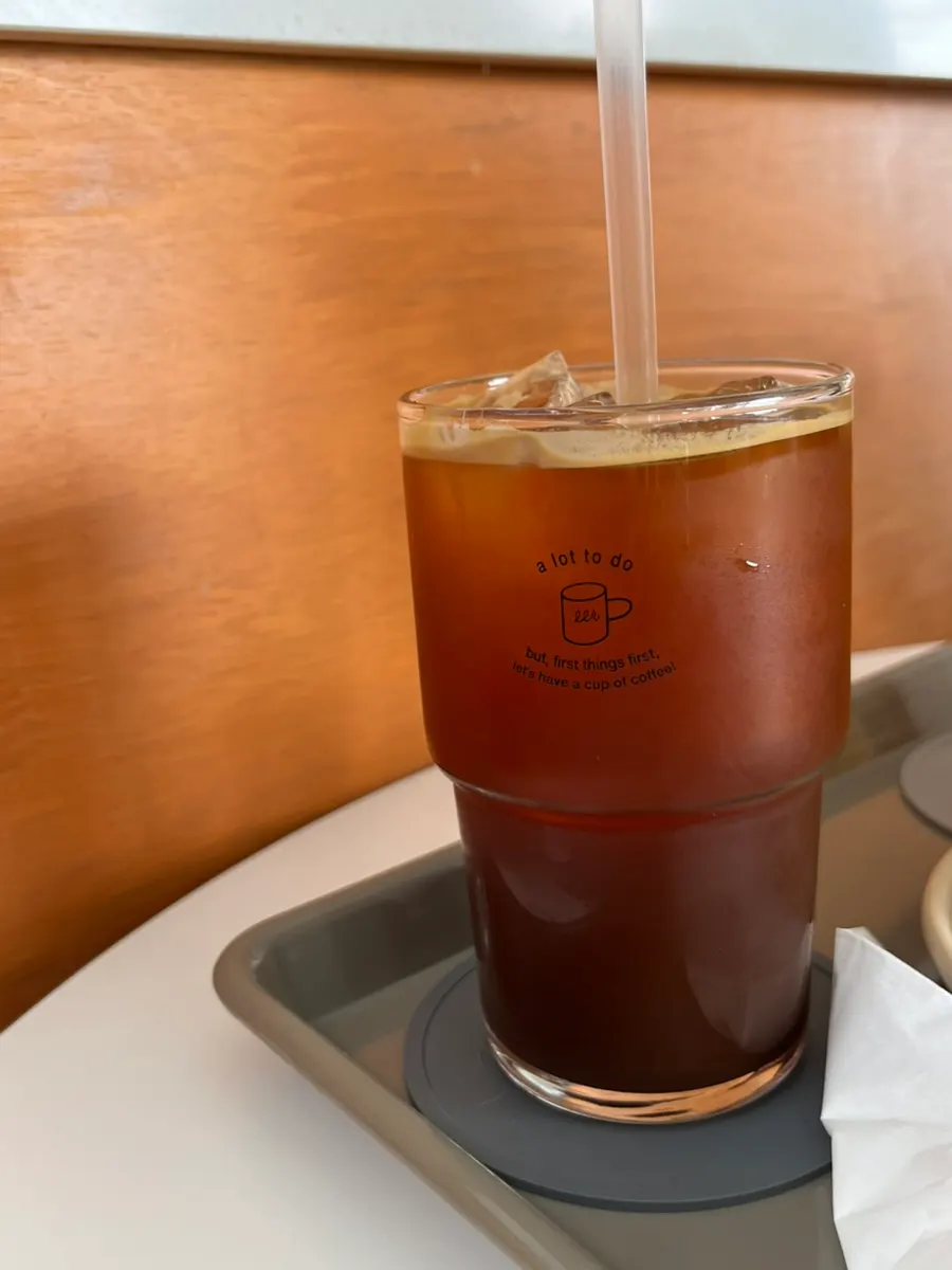 An iced americano made with acidic beans chosen at order