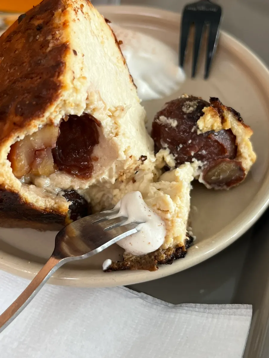 Dipping the chestnut Basque cheesecake in cream, served with coffee