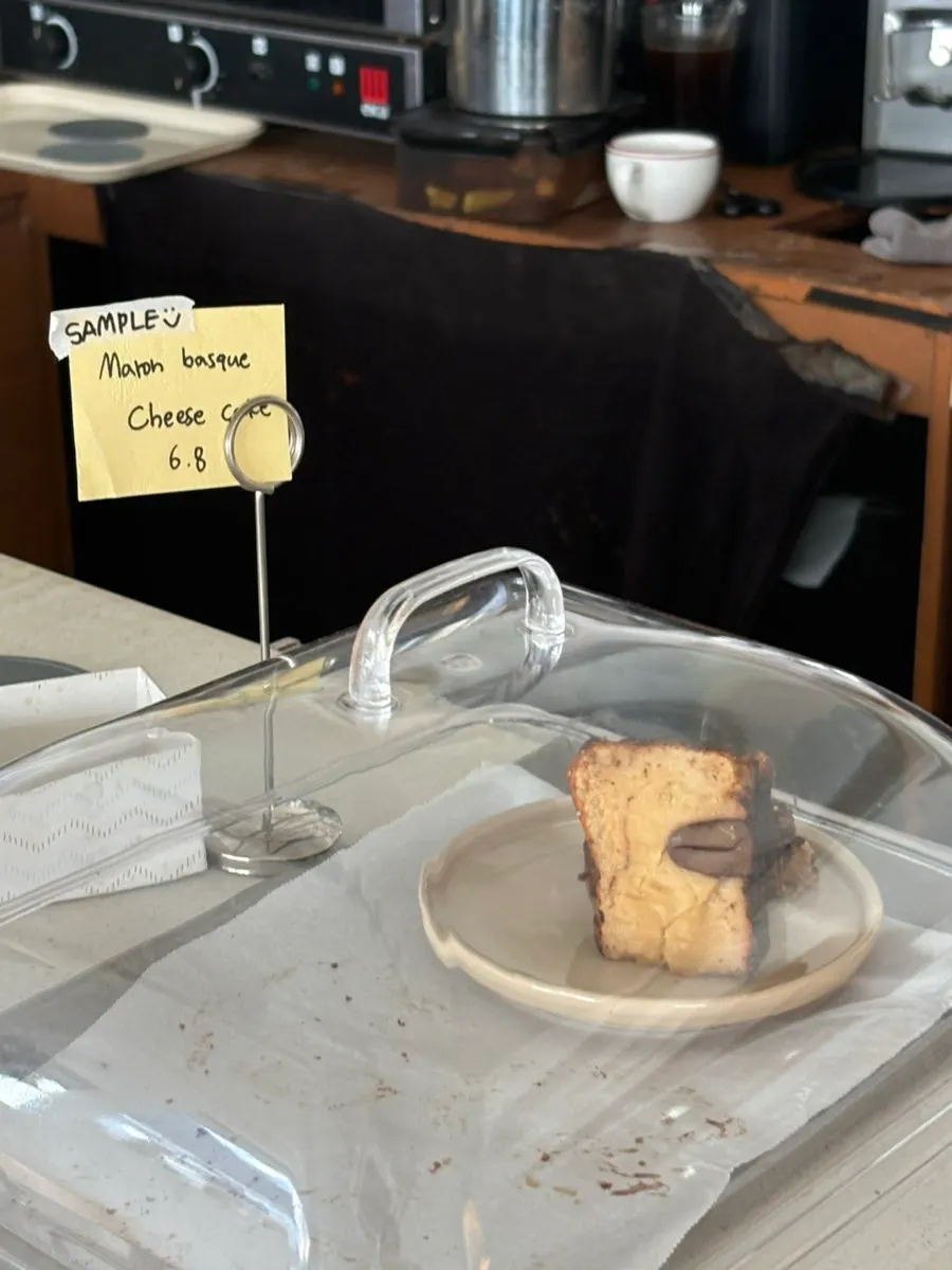 Baked goods and pastries displayed under an acrylic cover