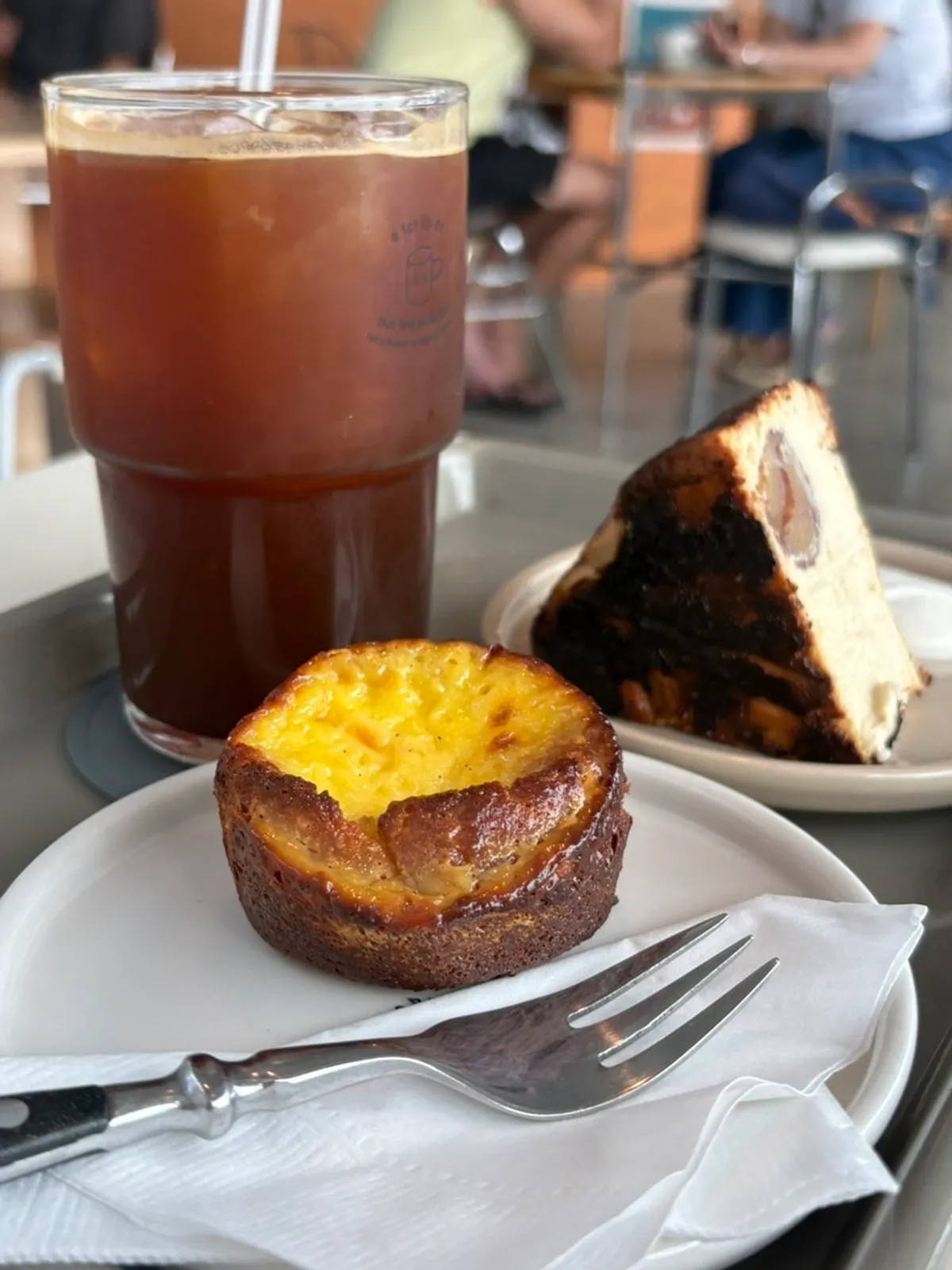 Egg financier served alongside coffee on the table